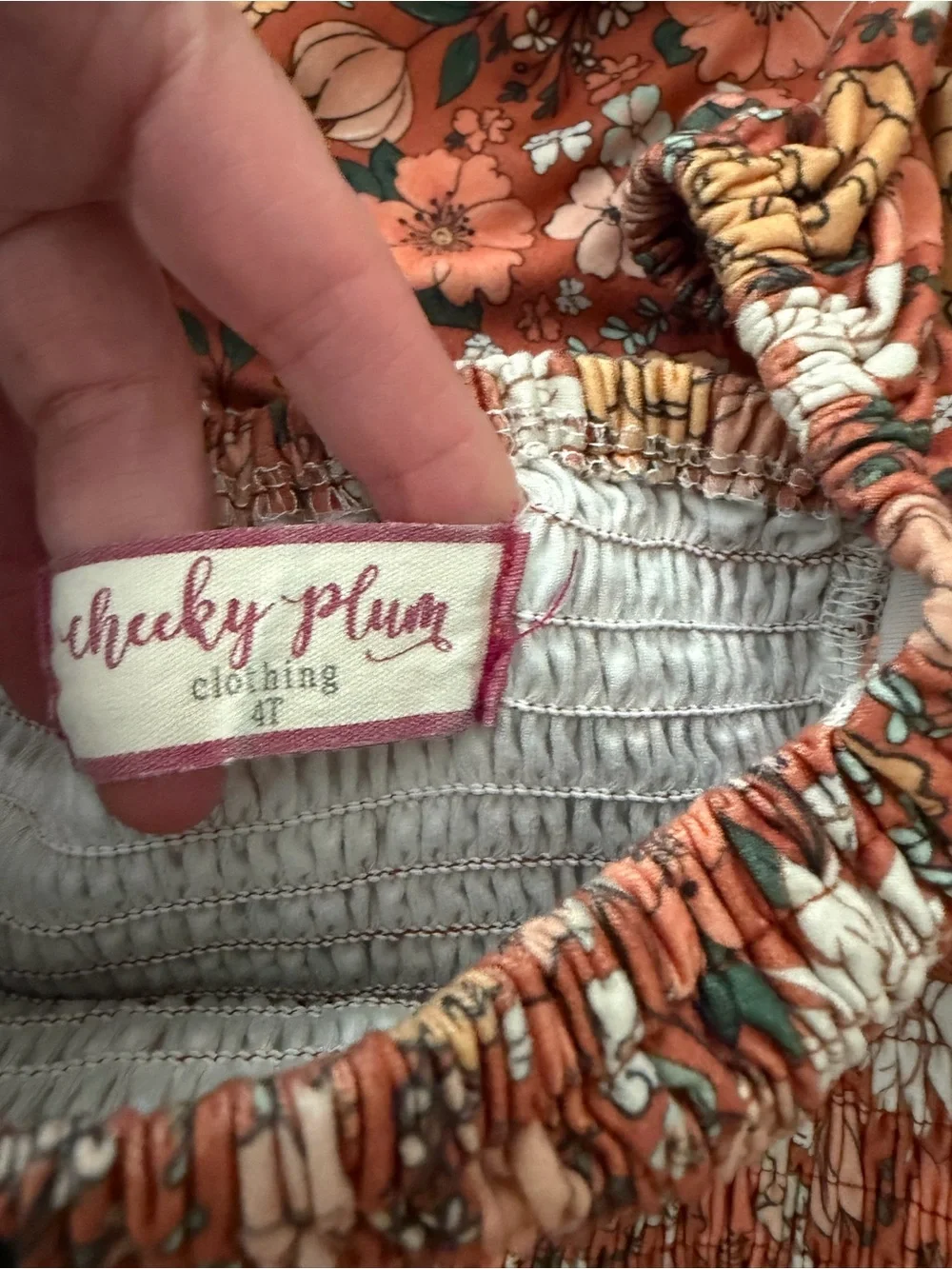 cheeky plum Rust Floral Smocked Jumpsuit with White & Mustard Flowers